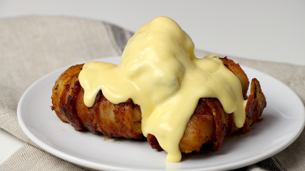 Bacon Wrapped Chicken Thighs With Cheddar Sauce